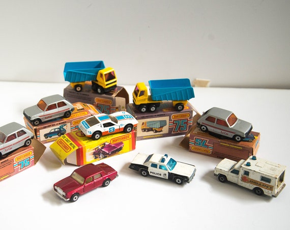 9 Lesney Die Cast Cars 1970s Some Boxes Articulated Truck Pink Window Le Car Orange Windos Rallye Royale, Police Car and 2 more matchbox