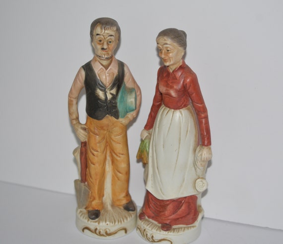 Vintage bisque porcelain Farmer Figurine Couple Old man and Old Lady with carrots and shovel