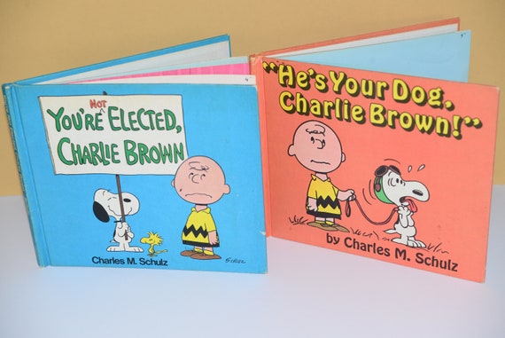 Two American Publishing 1973 and 1968 Charlie Brown Books He's your Dog Charlie Brown and You're Not elected Charlie Brown Hard Backs