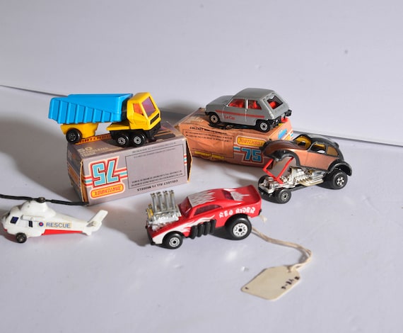 Lot of 5 Matchbox Lesney VW Funny Car, Le Car, articulated truck Dumptruck, helicopter, red rider two with boxes Hot Chocolate VW