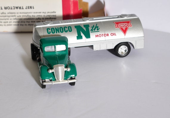 1937 Die cast Ertl Truck bank Conoco Oil Tanker Mint in box 1997 limited edition die cast toy.