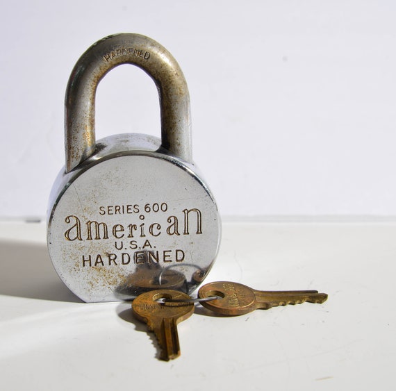 Vintage 1970s Heavy Stainless Steel Series 600 American Padlock with Key Super chunky and heavy works.