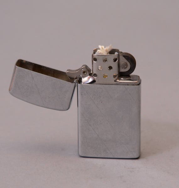 1977 Slim Line Diagonal and Straigh line engraved Zippo Lighter