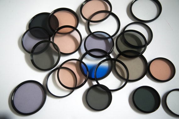 Lot of 20 Plus Tiffin Photography Filters 58mm to 82 mm Neutral Density , Gradient, UV and others with cases Misc Photography lens filters