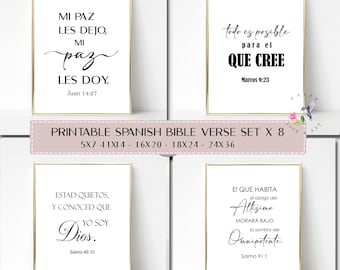 May include: A set of four framed prints with Spanish Bible verses in black script on a white background. The prints are in gold frames. The text includes verses from John 14:27, Mark 9:23, Psalm 46:10, and Psalm 91:1. The set is labeled as a printable Spanish Bible verse set.