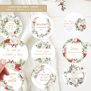 May include: Set of nine 2.5-inch Christmas Bible verse circle tags. Each tag features a floral wreath design with red and white flowers, green leaves, and gold text. Verses include "A Savior is Born," and "Glory to God."