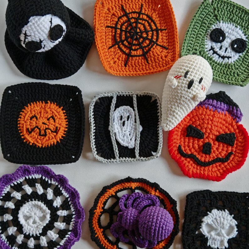 May include: A collection of handmade crochet Halloween decorations. The items include a black skull hat, orange spiderweb square, green skull square, black pumpkin square, white ghost, and a purple spider.