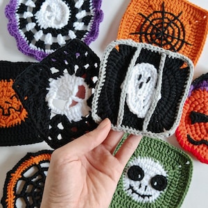 May include: A collection of colorful, handmade crochet Halloween coasters. Designs include a spiderweb, a skull, a ghost, and a jack-o'-lantern. The coasters are square and round, with a variety of colors including black, orange, white, green, and purple.