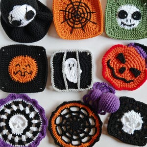 May include: A collection of handmade crochet Halloween decorations. Includes a black Grim Reaper hat, orange spiderweb square, green skull square, black jack-o'-lantern square, ghost square, and a purple crochet ball.