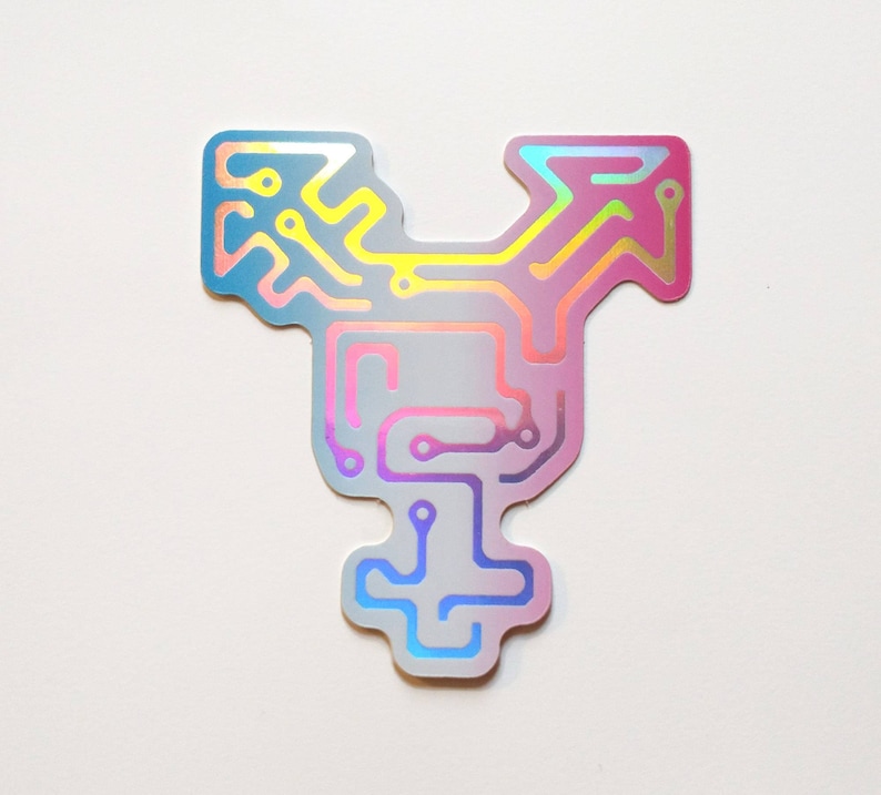 May include: A holographic sticker with a circuit board design in a transgender symbol shape. The sticker is a gradient of pink, blue, and white.
