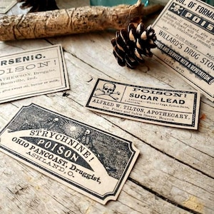 A scene showing antique reproduction label stickers from the Poison Bottle Labels sticker pack. The stickers are printed with blank ink on light brown kraft paper and are rectangular. Labels for formaldehyde, arsenic, sugar lead, strychnine, carbolic acid, corrosive sublimate and chloroform liniment are shown lying on a rustic wood surface.
