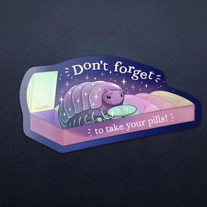 May include: A sticker featuring a cartoon pill bug in a pill box with the text "Don't forget to take your pills!". The pill bug is purple with iridescent accents. The pill box is pink and the background is dark blue.
