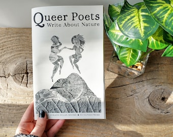 May include: A book titled "Queer Poets Write About Nature" by Zeraph Dylan Moore, published by Cutlines Press. The cover features a black and white illustration of two figures dancing on a tree stump.