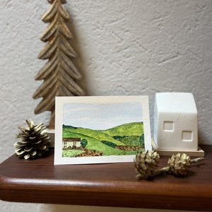Postal de acuarela de una casa de campo, perfecta para Pascua, Día de la Madre, cumpleaños, notas de agradecimiento o recuerdo.