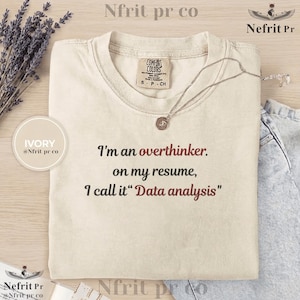 May include: A set of three ceramic mugs with a speckled, matte finish. The mugs are in shades of cream, light gray, and dark gray. Each mug has a simple, minimalist design, perfect for coffee or tea.