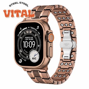May include: A rose gold-toned smartwatch with a matching metallic link band featuring integrated circular magnetic elements. The watch face displays a digital interface with the time 10:09, a parked car location indicator, and a small NYC analog clock sub-dial.