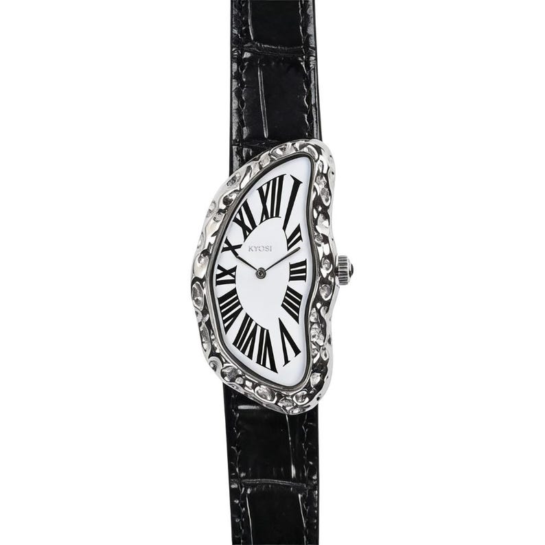 May include: A unique wristwatch with a distorted, melting clock face design. The watch features a white dial with black Roman numerals and a silver-toned bezel. The black leather band adds a classic touch.
