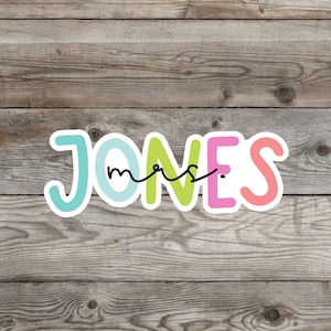 May include: Colorful, whimsical lettering spelling out "Mrs. Jones" with a handwritten "Mrs." in black cursive.