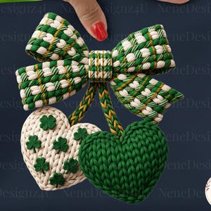 May include: A St. Patrick's Day themed design featuring a green and white woven bow, with two heart-shaped ornaments. One heart is green, the other is white with green shamrocks. The design is on a navy blue background.
