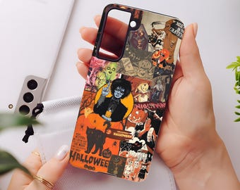 May include: A phone case featuring a collage of Halloween-themed images. The design includes a figure with blue skin, a black cat, pumpkins, and the word "Halloween" in orange and black. The case is held in a person's hands.