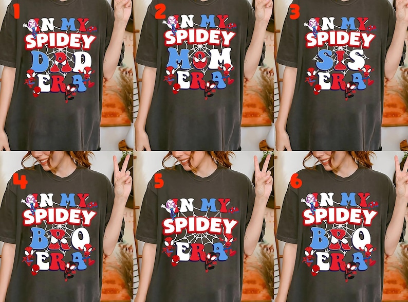 May include: Dark gray t-shirts with the text "N My Spidey Dad Era", "N My Spidey Mom Era", "N My Spidey Sis Era", "N My Spidey Bro Era", "N My Spidey Era". Each shirt features a Spider-Man theme with red, white, and blue accents.