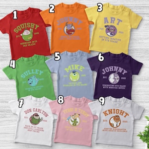 May include: Nine colorful short-sleeved t-shirts with cartoon character designs and text. The shirts are red, orange, yellow, green, light blue, purple, white, pink, and white. Each shirt has a different character and text related to school grades.