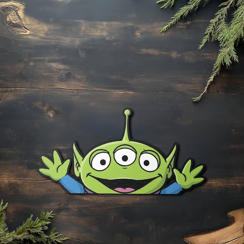 May include: A green alien character with three eyes, large ears, and a small antenna. The alien is smiling and waving, wearing a blue shirt. The image is a cartoon-style illustration.