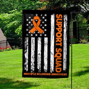 May include: A black garden flag with an orange ribbon and the text "SUPPORT SQUAD" in orange. The flag features a distressed American flag design with the words "MULTIPLE SCLEROSIS AWARENESS" at the bottom.