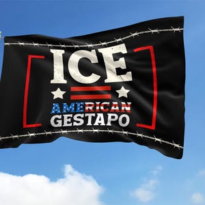 May include: Black flag with the words "ICE AMERICAN GESTAPO" in white and blue text, with red accents and barbed wire along the edges. The flag is waving against a blue sky with clouds.