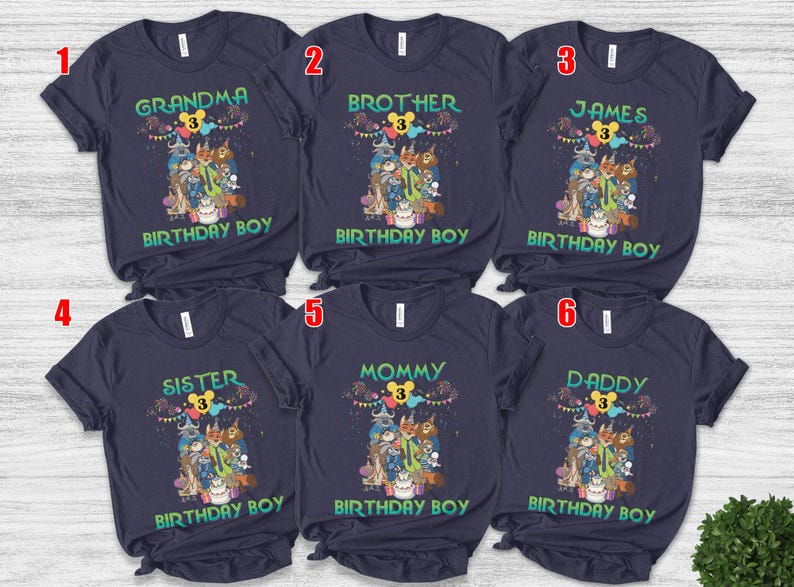 May include: Six dark navy blue short-sleeve t-shirts featuring a colorful graphic of cartoon animals, a birthday cake, and balloons. Each shirt displays a unique title: Grandma, Brother, James, Sister, Mommy, or Daddy, with the text Birthday Boy.