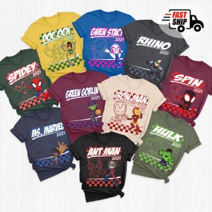 May include: A collection of colorful t-shirts featuring various Marvel characters. Each shirt displays a character's name and the year 2021, with designs including Doc Ock, Spidey, Gwen Stacy, Rhino, Iron Man, Ant Man, Spin, Hulk, and Ms. Marvel.