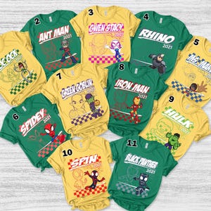 May include: A collection of eleven colorful t-shirts featuring various Marvel characters. Each shirt displays a character's name and a graphic illustration, including Doc Ock, Ant Man, Gwen Stacy, Rhino, Ms. Marvel, Spidey, Green Goblin, Iron Man, Hulk, Spin, and Black Panther.