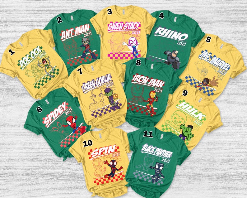 May include: A collection of eleven colorful t-shirts featuring various Marvel characters. Each shirt displays a character's name and a graphic illustration, including Doc Ock, Ant Man, Gwen Stacy, Rhino, Ms. Marvel, Spidey, Green Goblin, Iron Man, Hulk, Spin, and Black Panther.