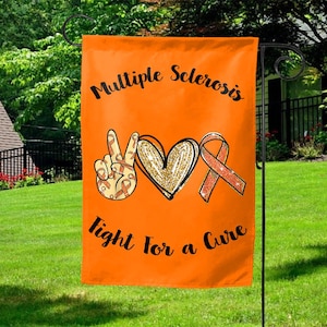 May include: Orange garden flag with the words "Multiple Sclerosis Fight for a Cure". The flag features a peace sign, a heart, and a ribbon, all in orange and gold colors.