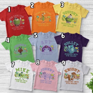 May include: Nine colorful short-sleeve t-shirts with cartoon character graphics and text. The shirts are red, orange, yellow, green, light blue, purple, white, pink, and white. Each shirt has a different character and grade level.