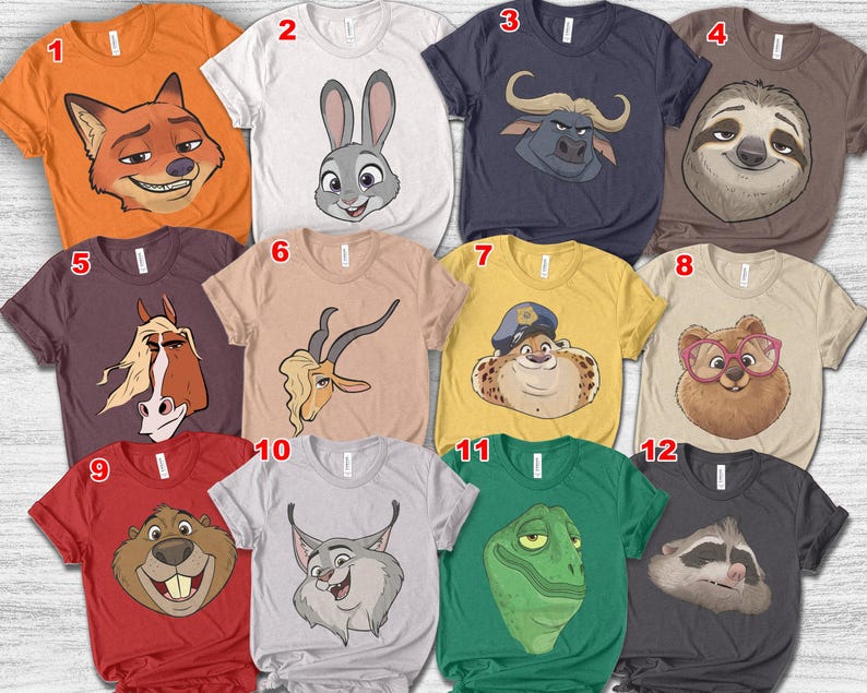 Puede incluir: Una colecci&oacute;n de doce camisetas gr&aacute;ficas con caras de animales de dibujos animados. Las camisetas son de varios colores, incluyendo naranja, blanco, azul marino, marr&oacute;n y rojo. Cada camiseta muestra un personaje animal diferente, como un zorro, un conejo, un perezoso y un castor.