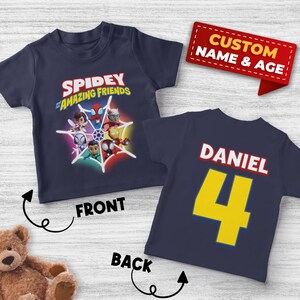 May include: Navy blue Spidey and His Amazing Friends t-shirt with a colorful graphic on the front. The back of the shirt has the name "Daniel" and the number "4" in yellow. A red banner reads "Custom Name & Age."