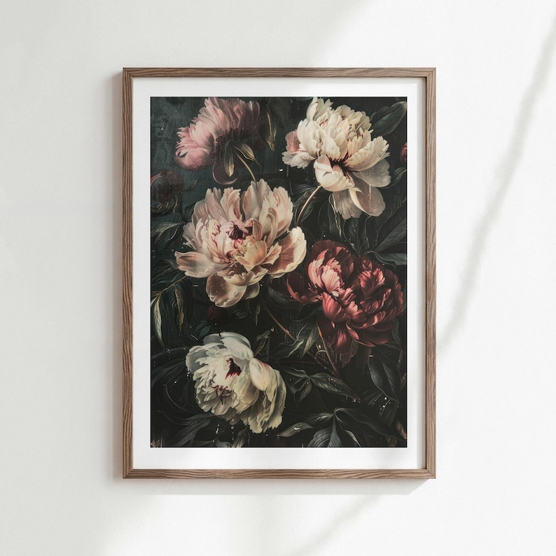 May include: A framed floral print featuring a dark background with several large peonies in shades of pink, cream, and burgundy. The flowers are surrounded by dark green leaves, creating a classic, elegant aesthetic.