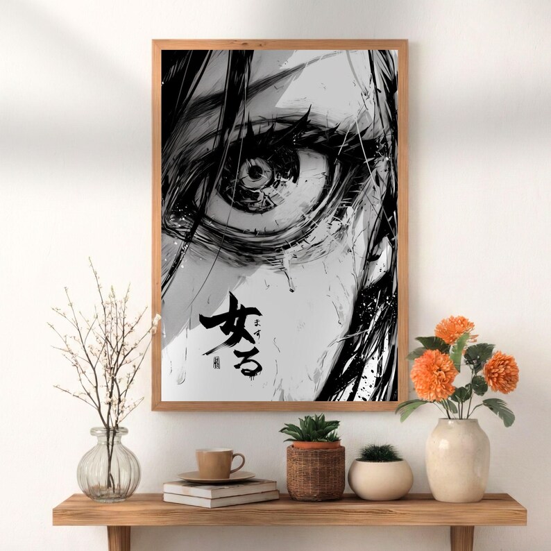 May include: A rectangular wall art print featuring a high-contrast black and white illustration of a detailed human eye with flowing hair. The artwork includes Japanese calligraphy characters in black ink positioned below the eye.