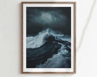 May include: A framed print featuring a dramatic ocean wave. The image captures a dark, moody seascape with a large wave cresting under a stormy sky. The wave is a mix of dark blue and white, creating a striking contrast.