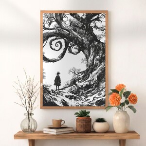 May include: Black and white framed art print depicting a large, detailed tree with swirling branches and a figure standing at its base. The artwork has a whimsical, fantasy theme. The frame is made of light brown wood.