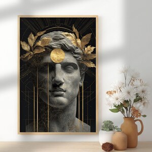 May include: Framed art print featuring a classical bust with a gold laurel wreath and a gold circle above the forehead. The background is black with gold lines, creating a striking contrast. The artwork is in a wooden frame.