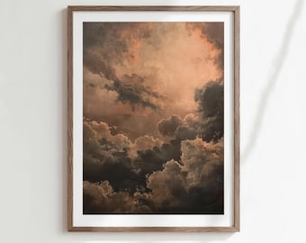 May include: Framed art print featuring a dramatic cloudscape in shades of brown, gray, and peach. The artwork depicts a detailed view of layered clouds, with light filtering through, creating a moody and atmospheric scene. The print is encased in a wooden frame.