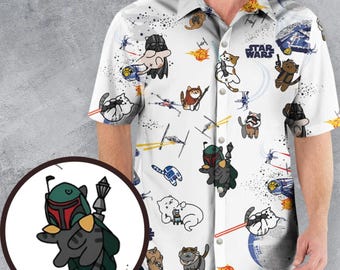 May include: A white short-sleeved button-down shirt featuring an all-over print of cartoon cats dressed as Star Wars characters, including Darth Vader and Boba Fett, alongside spaceships and the Star Wars logo, with a circular inset showing a cat as Boba Fett.