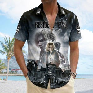 May include: Short-sleeved button-down shirt featuring a Resident Evil graphic. The design includes the text "RESIDENT EVIL requiem" and images of characters and a building. The shirt has a black and gray color scheme with the number "30" on the collar.