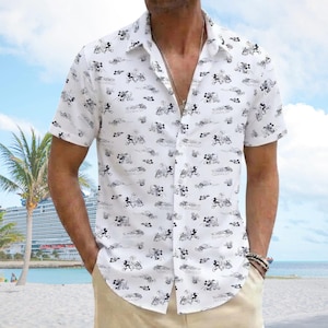 May include: A white short-sleeved button-down shirt featuring an all-over black line art print of Mickey Mouse characters in various poses. The shirt has a classic collar, a front button placket, and a straight hemline, crafted from a lightweight fabric.