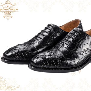 Handmade men’s black crocodile-style textured leather lace-up dress shoes with a polished finish. Crafted with genuine leather upper, cushioned insole, leather lining, and durable outsole for all-day comfort and support. Designed for weddings, parties, office wear, and formal business occasions. A premium handmade shoe that blends luxury, craftsmanship, and timeless sophistication for modern gentlemen. mens formal shoes
wedding shoes men
party wear shoes
business shoes men
polished dress shoes