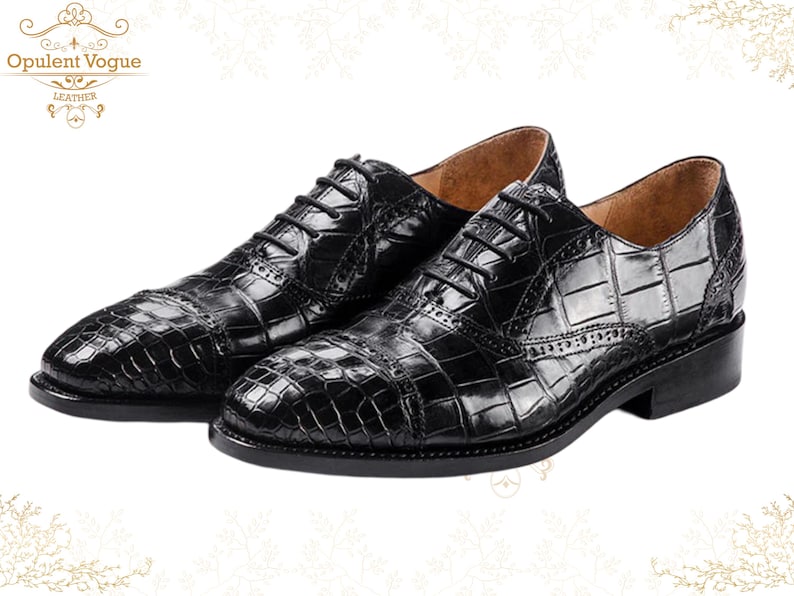 Handmade men’s black crocodile-style textured leather lace-up dress shoes with a polished finish. Crafted with genuine leather upper, cushioned insole, leather lining, and durable outsole for all-day comfort and support. Designed for weddings, parties, office wear, and formal business occasions. A premium handmade shoe that blends luxury, craftsmanship, and timeless sophistication for modern gentlemen. mens formal shoes
wedding shoes men
party wear shoes
business shoes men
polished dress shoes