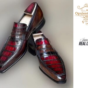 Handmade men’s burgundy moccasin shoes with shaded alligator-textured leather finish. Featuring a polished slip-on design, cushioned insole, smooth lining, and durable outsole. Luxury handmade leather business shoes perfect for weddings, office wear, parties, and formal occasions. handmade moccasins, burgundy alligator shoes, mens slip on dress shoes, embossed leather moccasins, genuine leather shoes, office wear shoes, wedding