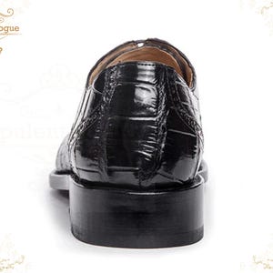 Handmade men’s black crocodile-style textured leather lace-up dress shoes with a polished finish. Crafted with genuine leather upper, cushioned insole, leather lining, and durable outsole for all-day comfort and support. Designed for weddings, parties, office wear, and formal business occasions. A premium handmade shoe that blends luxury, craftsmanship, and timeless sophistication for modern gentlemen. mens formal shoes
wedding shoes men
party wear shoes
business shoes men
polished dress shoes